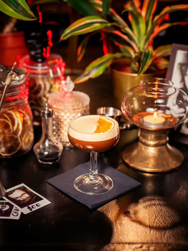 Cocktail close-up with warm amber light